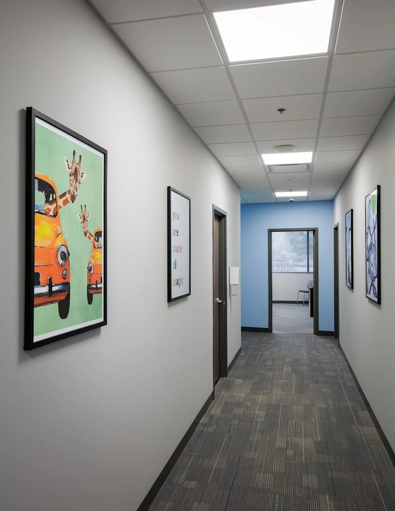 Hallway with art on walls at Northpoint Imagine Fort Collins